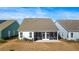Aerial view of the back of the home featuring a screened in porch, patio, and outdoor grill at 236 River Martin Ct, Summerville, SC 29483