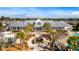 An elegant clubhouse view, featuring a pool and palm-lined pathways, ideal for relaxation and social gatherings at 236 River Martin Ct, Summerville, SC 29483