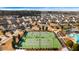 A vibrant aerial view of a community featuring lush greenery, tennis courts, a pool, and attractive homes in a neighborhood at 236 River Martin Ct, Summerville, SC 29483