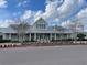 A beautiful community clubhouse featuring an entrance flanked by trees providing a grand and welcoming space for members at 236 River Martin Ct, Summerville, SC 29483