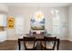 Bright dining room with large light fixture and a view of wall art and decor at 236 River Martin Ct, Summerville, SC 29483