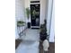 Inviting front porch adorned with seasonal plants and elegant decor at 236 River Martin Ct, Summerville, SC 29483