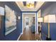Hallway featuring hardwood floors, stylish lighting, and elegant decor at 236 River Martin Ct, Summerville, SC 29483