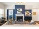 Living room featuring hardwood floors, a fireplace, and a stylish decor at 236 River Martin Ct, Summerville, SC 29483