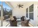 Back porch features a ceiling fan, seating for four, and an outdoor grill at 236 River Martin Ct, Summerville, SC 29483