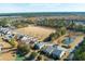 Aerial shot of home situated near a tranquil pond and field in a friendly neighborhood at 243 Clayburne Dr, Goose Creek, SC 29445