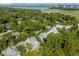 Aerial view of a neighborhood with lush trees and a view of the waterfront at 25 Duany Rd, Mount Pleasant, SC 29464