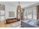 Comfortable bedroom with a leather sofa, cozy rug, and window with plantation shutters at 25 Duany Rd, Mount Pleasant, SC 29464