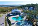 Aerial view of the pool, amenity center, and the surrounding houses in a charming coastal community at 2613 Hatch Dr, Johns Island, SC 29455