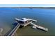 Aerial view of a covered dock with multiple piers offering serene waterfront access for boats at 2613 Hatch Dr, Johns Island, SC 29455