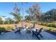 Inviting backyard patio featuring comfortable seating around a stylish fire pit, perfect for outdoor entertaining at 2613 Hatch Dr, Johns Island, SC 29455