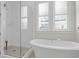 Bright bathroom with a separate shower and soaking tub, complemented by large windows at 2613 Hatch Dr, Johns Island, SC 29455