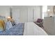 Bedroom featuring bed with patterned bedding, a chair, and three doors at 2613 Hatch Dr, Johns Island, SC 29455