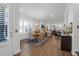 Open-concept dining and living space features hardwood floors and bright natural light at 2613 Hatch Dr, Johns Island, SC 29455