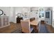 Dining area showcases a wooden table with seating for six under an elegant light fixture at 2613 Hatch Dr, Johns Island, SC 29455