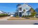 Charming two-story home featuring a detached garage and lush landscaping in a desirable neighborhood setting at 2613 Hatch Dr, Johns Island, SC 29455