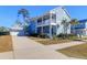 Beautiful two-story home with a detached garage, a spacious driveway, and well-maintained lawn at 2613 Hatch Dr, Johns Island, SC 29455