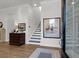 Welcoming foyer with wood floors, staircase, and elegant decor creates an inviting entrance at 2613 Hatch Dr, Johns Island, SC 29455