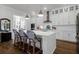 Bright, open kitchen with large island, shaker cabinets, stainless appliances, and barstool seating at 2613 Hatch Dr, Johns Island, SC 29455