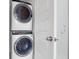 Stackable washer and dryer next to the glass enclosed shower at 2613 Hatch Dr, Johns Island, SC 29455