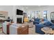 Comfortable living room with a fireplace, plush seating, and plenty of natural light at 2613 Hatch Dr, Johns Island, SC 29455