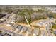 Aerial view of a residential neighborhood surrounded by lush greenery and featuring various home styles at 3034 Cross Vine Ln, Summerville, SC 29483