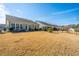 A wide backyard with grass and black metal fencing at 3034 Cross Vine Ln, Summerville, SC 29483