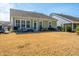 A backyard with grass, patio and black metal fencing at 3034 Cross Vine Ln, Summerville, SC 29483