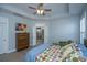 Bedroom with tray ceiling and an open doorway to the bath at 3034 Cross Vine Ln, Summerville, SC 29483