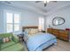 Bedroom featuring natural light, wood floors, and a green arm chair at 3034 Cross Vine Ln, Summerville, SC 29483