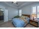 Bedroom with ceiling fan, tray ceiling, and natural light from the windows at 3034 Cross Vine Ln, Summerville, SC 29483