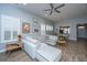 Inviting living room with a sectional sofa, stylish decor, and lots of natural light from the windows at 3034 Cross Vine Ln, Summerville, SC 29483