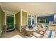 Relaxing covered porch with comfortable seating, an outdoor rug, and a welcoming entrance at 3034 Cross Vine Ln, Summerville, SC 29483