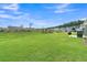 A very large lawn with a screened-in patio and barbeque set provides plenty of room for recreation at 306 Autumn Azalea Way, Summerville, SC 29486
