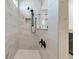 This bathroom shows a walk-in shower with white marble-like walls, a rainfall shower head and glass shower wall at 306 Autumn Azalea Way, Summerville, SC 29486