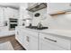 A detail of a gourmet kitchen featuring white cabinets, stainless steel appliances, and quartz countertops at 306 Autumn Azalea Way, Summerville, SC 29486