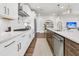 A well-equipped modern kitchen with stainless steel appliances, a large island, and stylish pendant lighting at 306 Autumn Azalea Way, Summerville, SC 29486