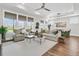 Spacious living room with comfortable seating, large windows, and a view of the outdoors at 306 Autumn Azalea Way, Summerville, SC 29486