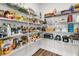 A well-stocked pantry with multiple shelves, filled with food, kitchen items, and supplies for an organized home at 306 Autumn Azalea Way, Summerville, SC 29486