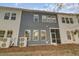 Rear exterior view of home with a screened porch and multiple windows at 3066 Emma Ln, Mount Pleasant, SC 29466