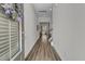 Bright hallway with wood-look flooring and white walls, leading to the rest of the home at 3066 Emma Ln, Mount Pleasant, SC 29466
