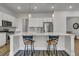 Modern kitchen featuring stainless steel appliances, a large center island with seating, and stylish pendant lighting at 3066 Emma Ln, Mount Pleasant, SC 29466