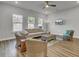 Inviting living room with wood floors, neutral walls, ceiling fan, and comfortable seating arrangement at 3066 Emma Ln, Mount Pleasant, SC 29466