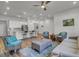 Open-concept living room and kitchen with hardwood floors and plenty of space for entertaining at 3066 Emma Ln, Mount Pleasant, SC 29466