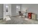 Well-lit office space with a desk, rolling chair, and carpeting at 3066 Emma Ln, Mount Pleasant, SC 29466