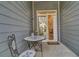 Cozy patio with table and chairs, and sliding glass doors leading into the house at 3066 Emma Ln, Mount Pleasant, SC 29466
