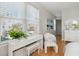 Bright bedroom with large windows, wood floors, and white furniture at 33 Calhoun St # 218, Charleston, SC 29401