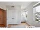 This bedroom features white walls, hardwood floors, and a double door closet offering ample storage space at 33 Calhoun St # 218, Charleston, SC 29401