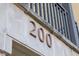 Close-up of the building number '200' displayed on the exterior, showing architectural detail at 33 Calhoun St # 218, Charleston, SC 29401