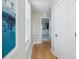 Hallway with hardwood floors leading to bathroom at 33 Calhoun St # 218, Charleston, SC 29401